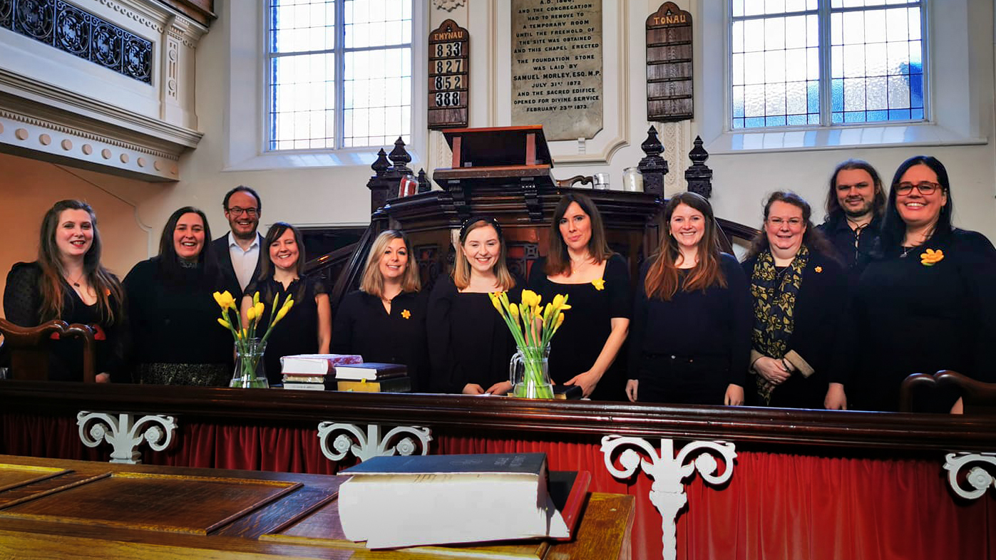 A photograph of Côr Dinas in the Borough Chapel after singing for the St David's Day Service in 2022